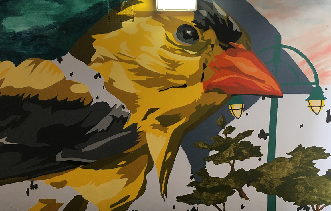 A close up of a bird in the Migration mural.