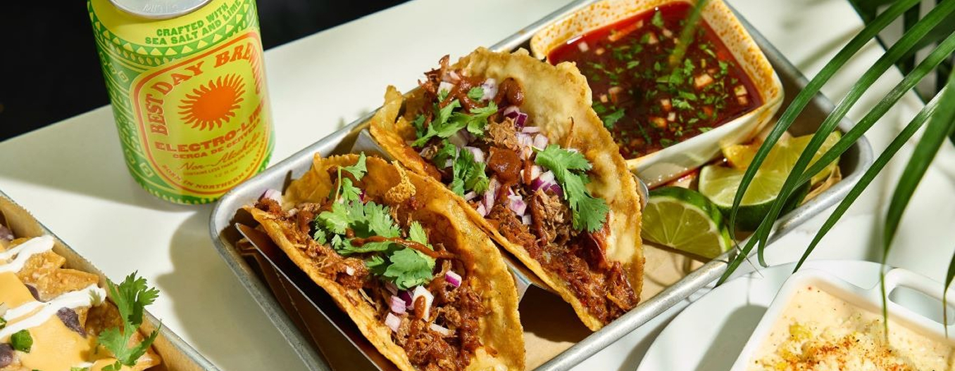 A plate of tacos on a table.
