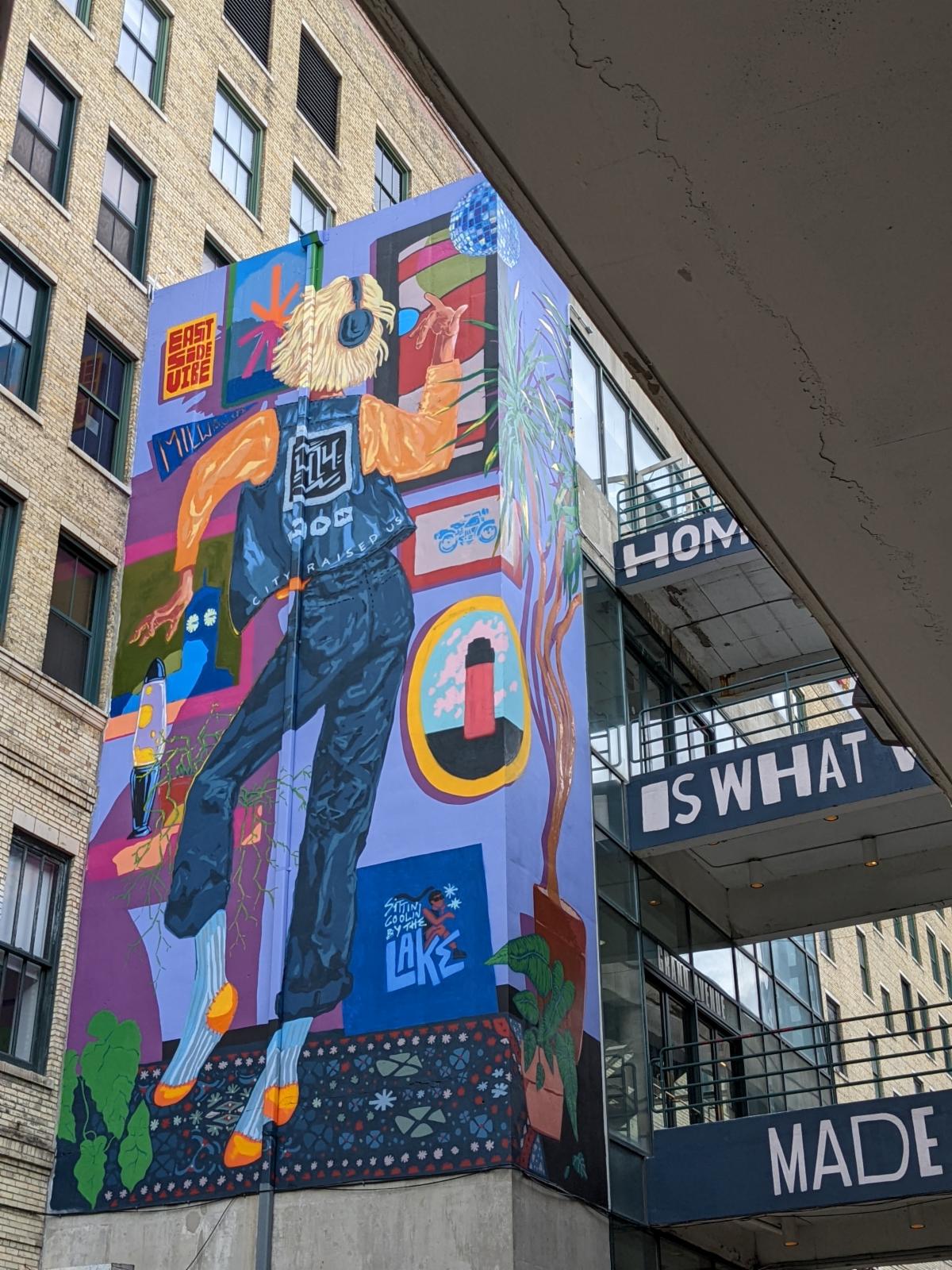 The colorful Hometown Love mural features a woman dancing.