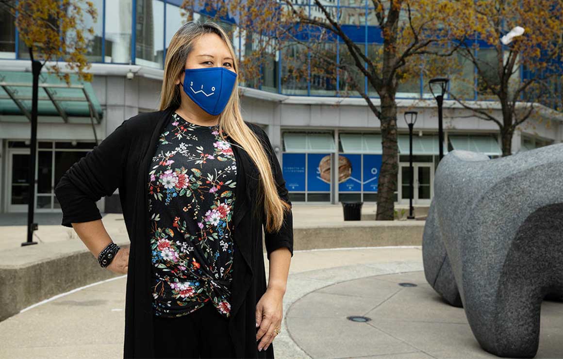 Kim Guerrero poses outside.