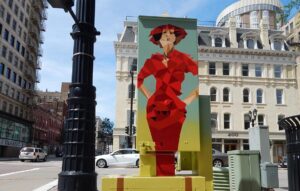 ubox-fashion-design-milwaukee-downtown A utility box mural features a fashionable woman from the 1920s.