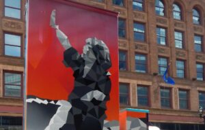 ubox-wisconsin-ave-parades-milwaukee-downtown This utility box mural depicts the late Milwaukee-native Charlotte Rae waving.