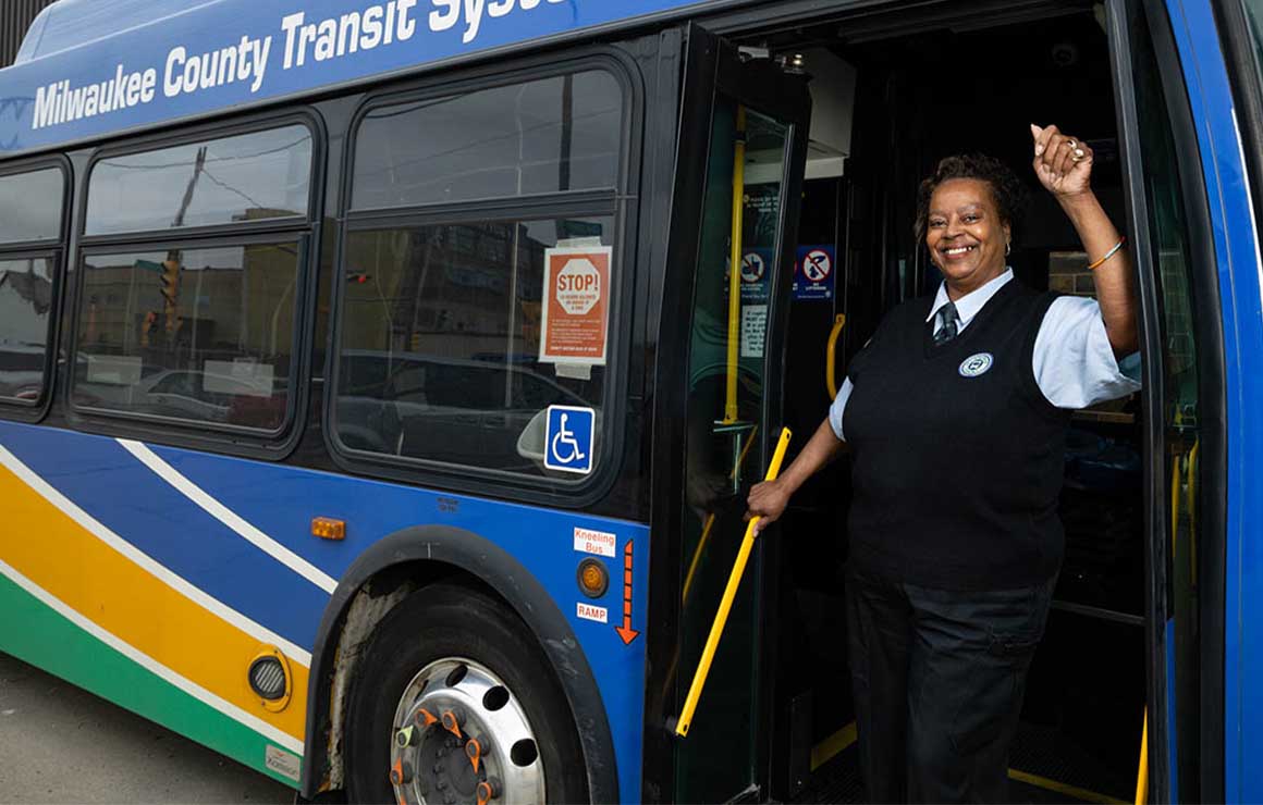 Willie Nash stands in the entry of a bus.