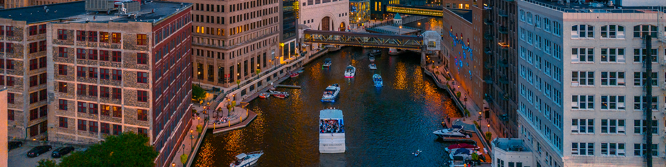 Downtown Data Hub header Boats floating down the river in Downtown Milwaukee.