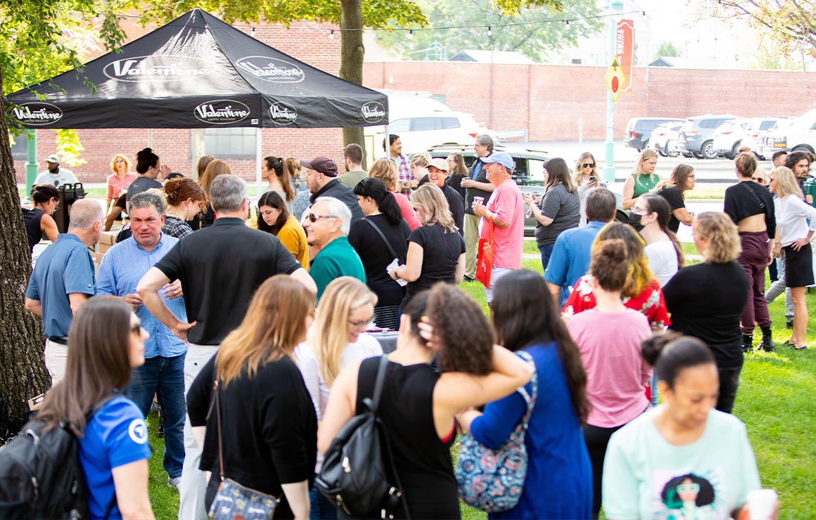 A crowd of people at a lunchtime giveaway.