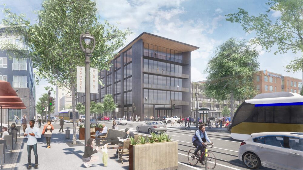 MKE2040_1920_6-e1712174124200 Rendering of a street in Milwaukee with a contemporary glass building with about four floors.