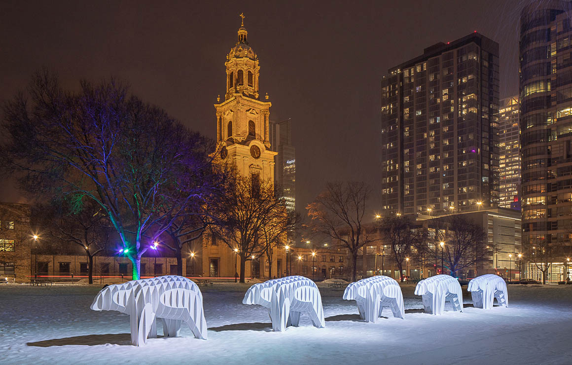 Massimals MKE Web The Massimals polar bears on a snowy evening in Cathedral Square Park.