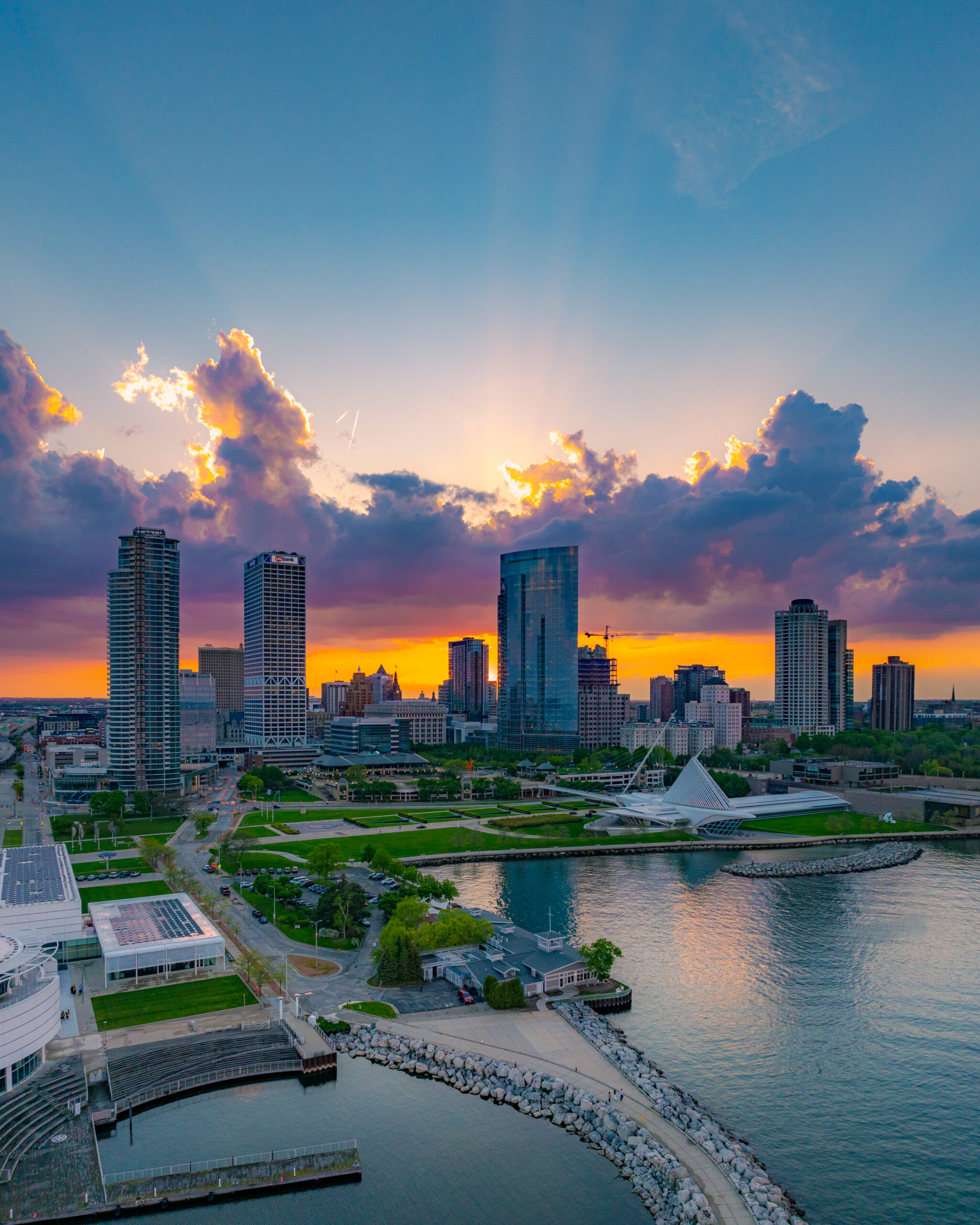 Downtown Milwaukee skyline photo with the sunset in the back.