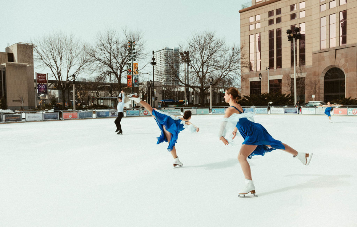 Figure skaters on the ice rink at Red Arrow Park.