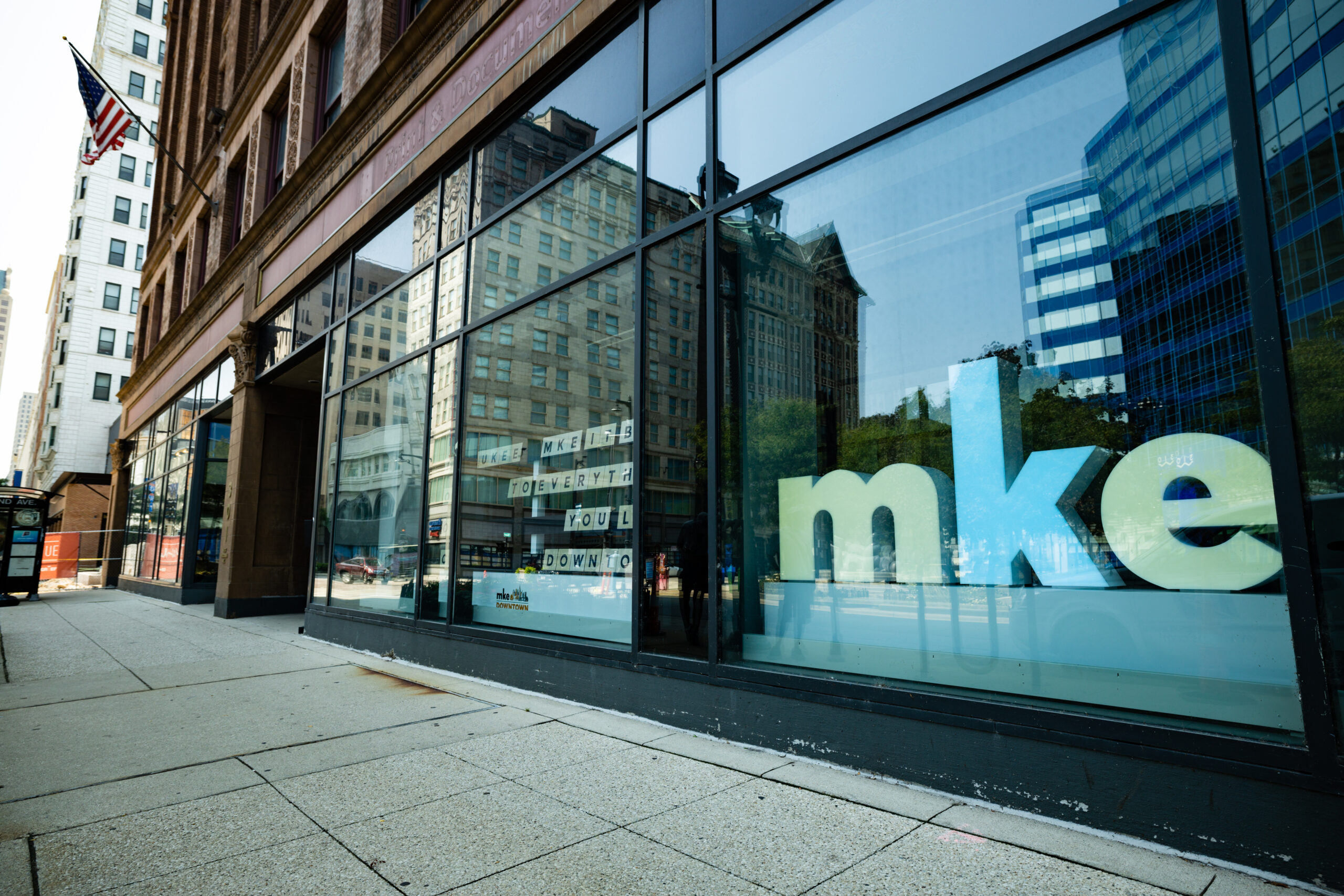 img_corePrograms2020_AFeller-088 A downtown storefront with the letters MKE In the window.