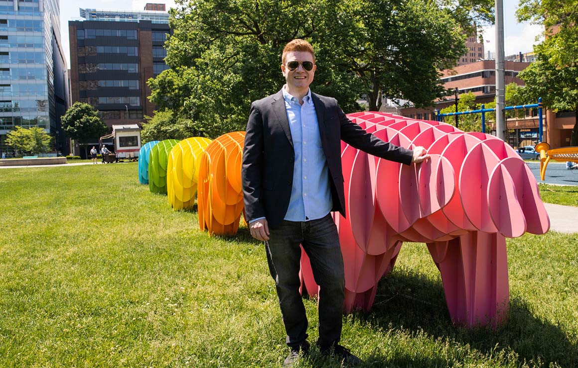 jason scroggin Jason Scroggin stands in front of the Massimals.