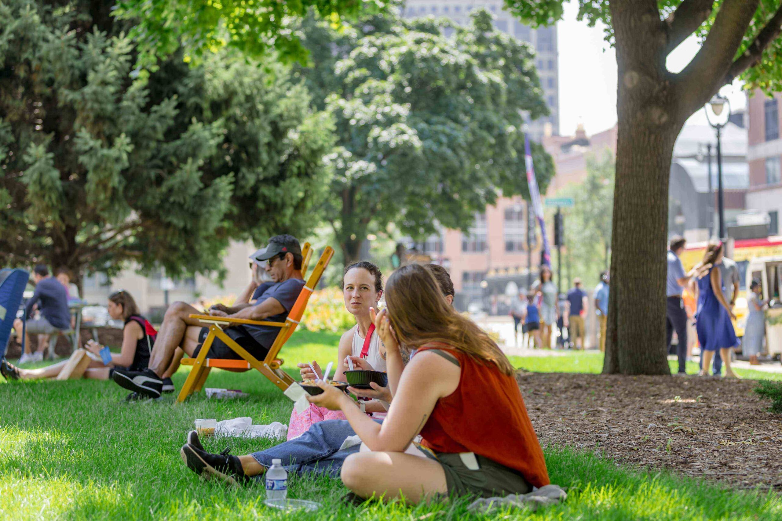 live_downtown friends enjoying green space outside